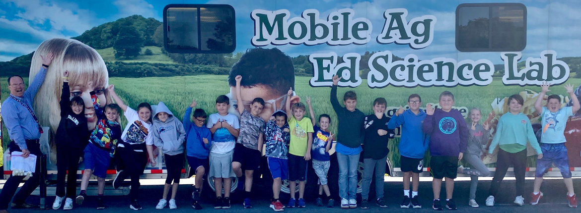 students in front of mobile ag science lab
