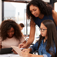 teacher helping student